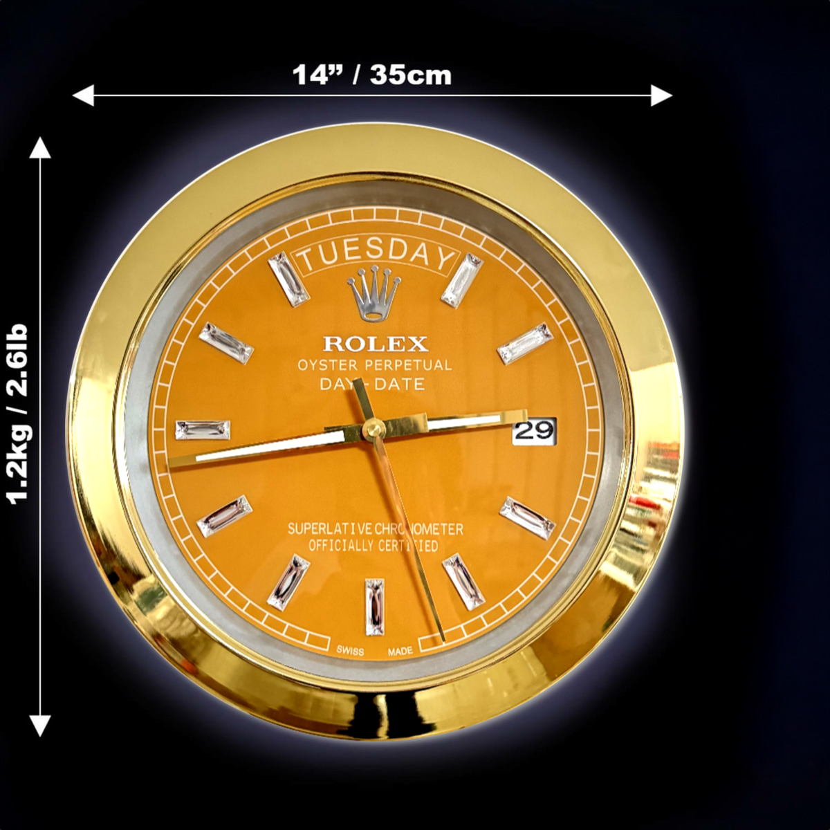 Gold-framed Rolex Oyster Perpetual Day-Date wall clock with an orange face, diamond hour markers, and day and date display, measuring 14 inches (35 cm) in diameter and weighing 1.2 kg (2.6 lb)