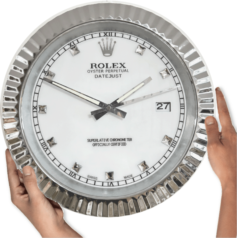 Close-up of two hands holding a large Rolex Oyster Perpetual Datejust wall clock with a white face, silver frame, Roman numeral and diamond-shaped hour markers, showing the time as 10:10 and the date as 27.