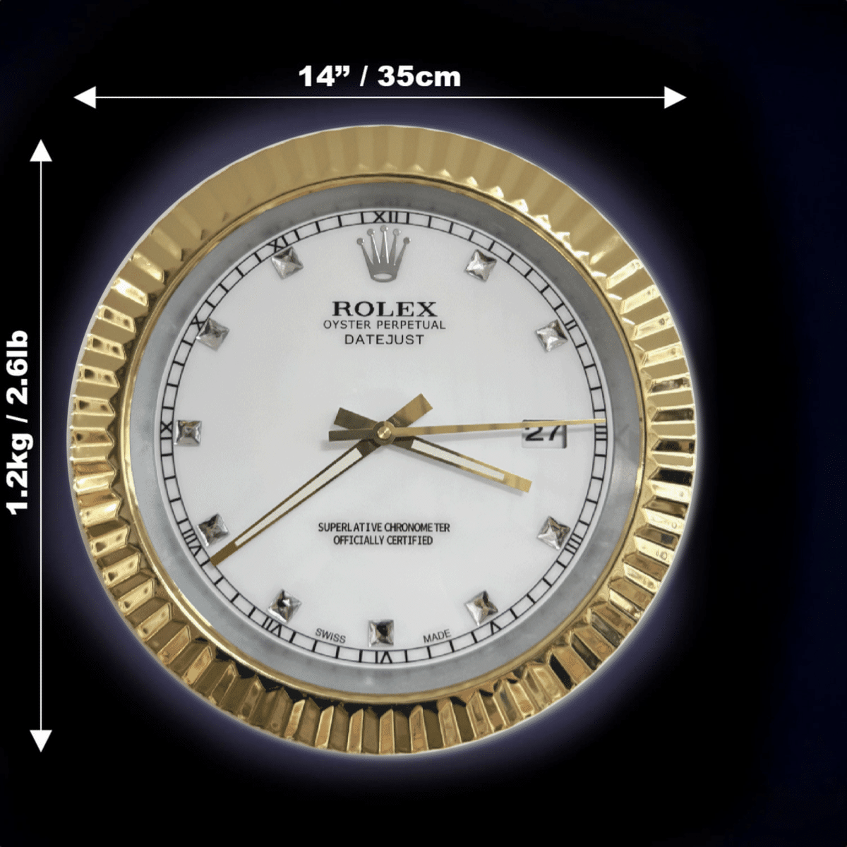 Round Rolex Oyster Perpetual Datejust clock with a gold fluted bezel, white dial, diamond hour markers, and gold hands showing 4:35:42, with dimensions 14 inches (35 cm) diameter and 1.2 kg (2.61 lb) weight indicated on a black background.