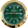 Close-up of a Rolex Oyster Perpetual Day-Date watch with a green dial, gold bezel, diamond hour markers, and displaying Dinsdag the 27th