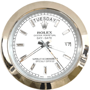 Close-up of a round Rolex Oyster Perpetual Day-Date watch face with a white dial, silver hour markers, and silver hands indicating the time at 10:39:38, showing the day as Dinsdag and the date as 17.