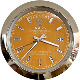 Close-up of a Rolex Oyster Perpetual Day-Date watch face with a golden dial displaying the day Tuesday and the date 29, featuring diamond hour markers and a silver bezel.