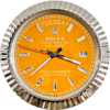 Close-up of a Rolex Oyster Perpetual Day-Date watch with an orange dial, silver hour markers, and a silver fluted bezel showing the day as tirsdag and the date as 29.