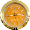 Close-up of a gold-framed Rolex Oyster Perpetual Day-Date watch with an orange dial showing the day as tirsdag and the date as 29.