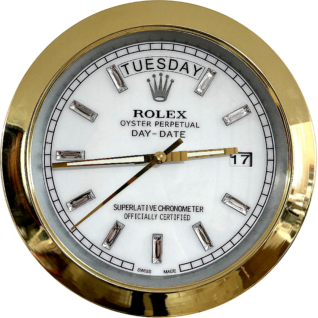 Close-up of a Rolex Oyster Perpetual Day-Date watch with a gold bezel, white dial, day display showing tirsdag, date display showing 17, and diamond hour markers.