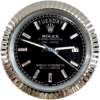 Close-up of a Rolex Oyster Perpetual Day-Date watch face with a black dial, silver hour markers with diamond accents, displaying Dinsdag and the date 17, with silver fluted bezel.