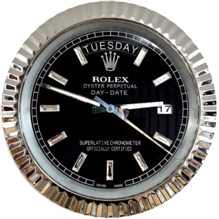 Close-up of a Rolex Oyster Perpetual Day-Date watch face with a black dial, silver hour markers with diamond accents, displaying Martedì and the date 17, with silver fluted bezel.