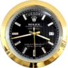 Close-up of a Rolex Oyster Perpetual Day-Date wall clock with a black dial, diamond hour markers, gold hands, gold outer rim, displaying terça-feira and the date 17.