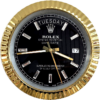 Close-up of a Rolex Oyster Perpetual Day-Date watch with a black dial encased in a gold fluted bezel, diamond hour markers, showing the day as Martedì, date as 17, and time approximately 8:44:28.