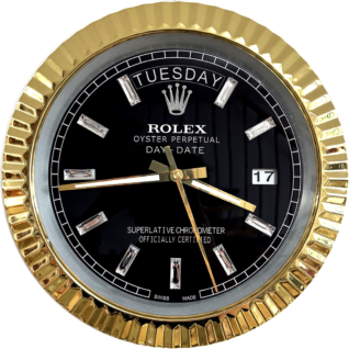 Close-up of a Rolex Oyster Perpetual Day-Date watch with a black dial encased in a gold fluted bezel, diamond hour markers, showing the day as Tuesday, date as 17, and time approximately 8:44:28.