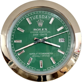 Rolex Oyster Perpetual Day-Date watch face with green dial, silver hour markers, and day and date display showing Tuesday and 26, surrounded by a shiny metallic bezel.