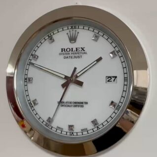 Close-up of a Rolex Oyster Perpetual Datejust watch with a white face, diamond hour markers, date display showing 27, and silver bezel.