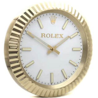 A Rolex wall clock styled like a Day-Date watch, featuring a white dial, gold hands, gold indices, and a fluted gold bezel.